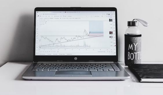 Laptop displaying profile dashboard of Devops consulting services by RBCH Developers.